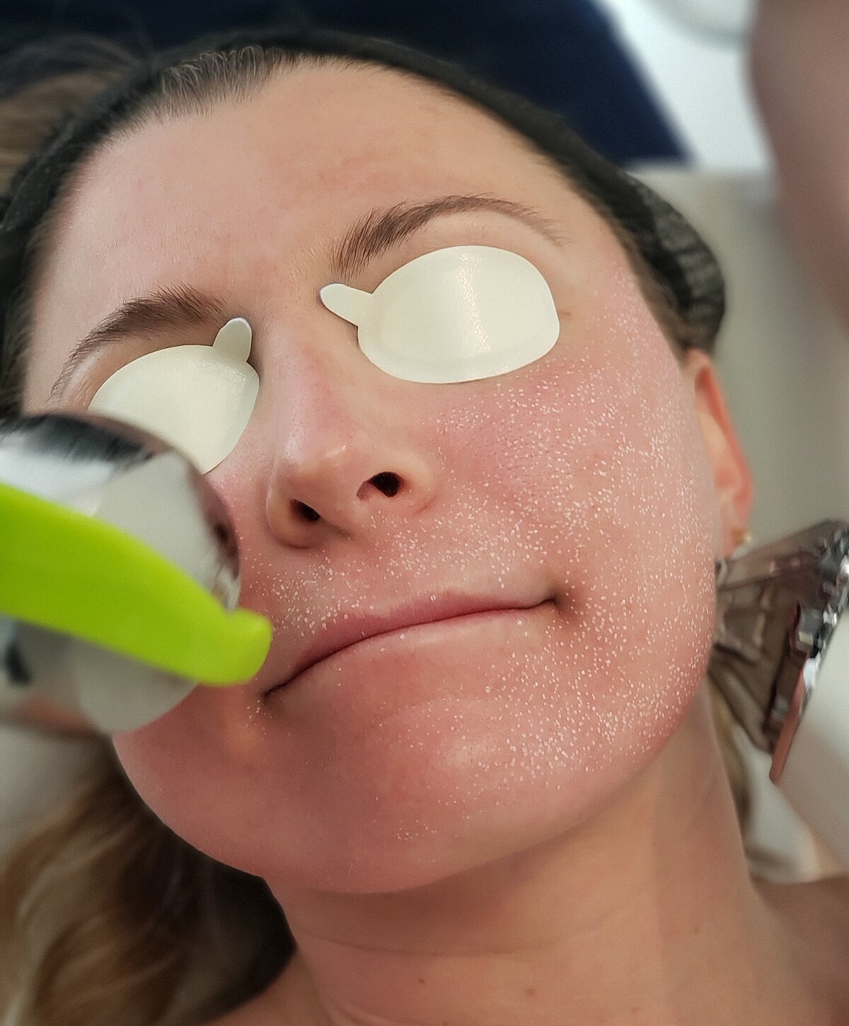 Portrait of a woman with long wavy hair.