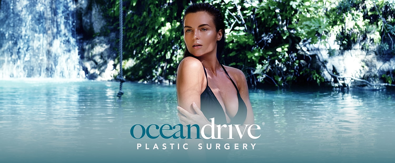 Woman in swimsuit near waterfall, Ocean Drive branding.