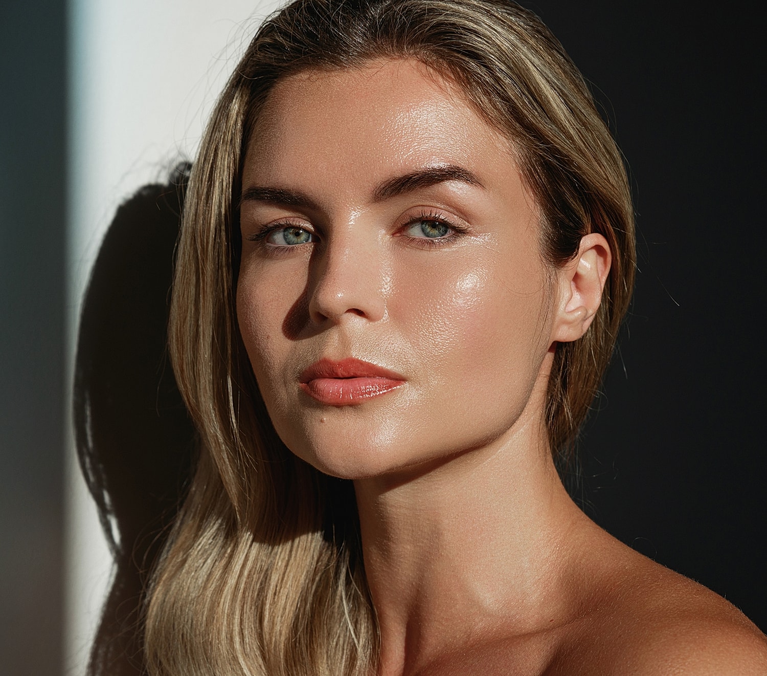 Portrait of a woman with glowing skin.