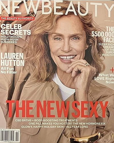 Magazine cover featuring smiling woman with curly hair.