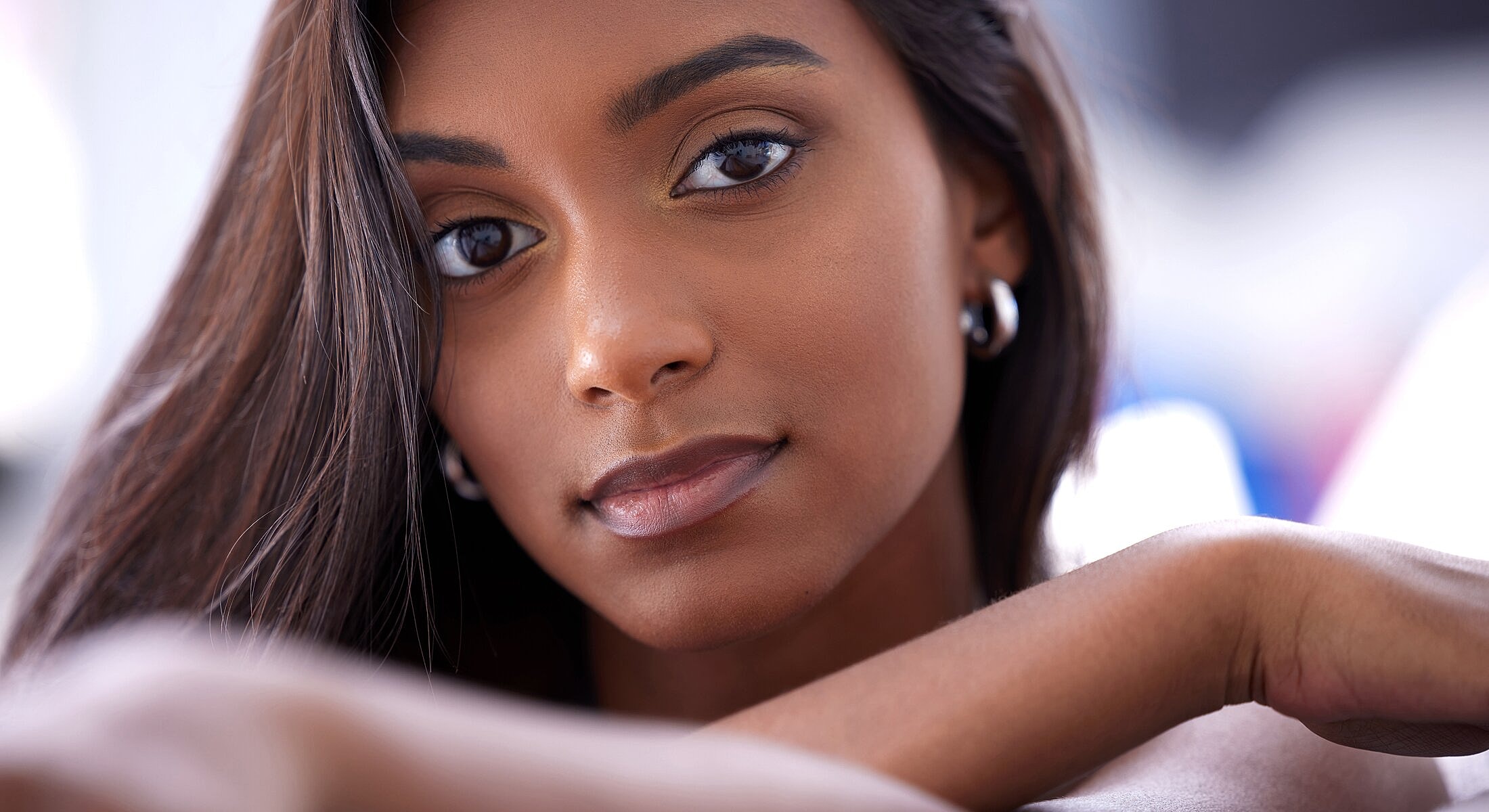 Close-up portrait of a woman with long hair.